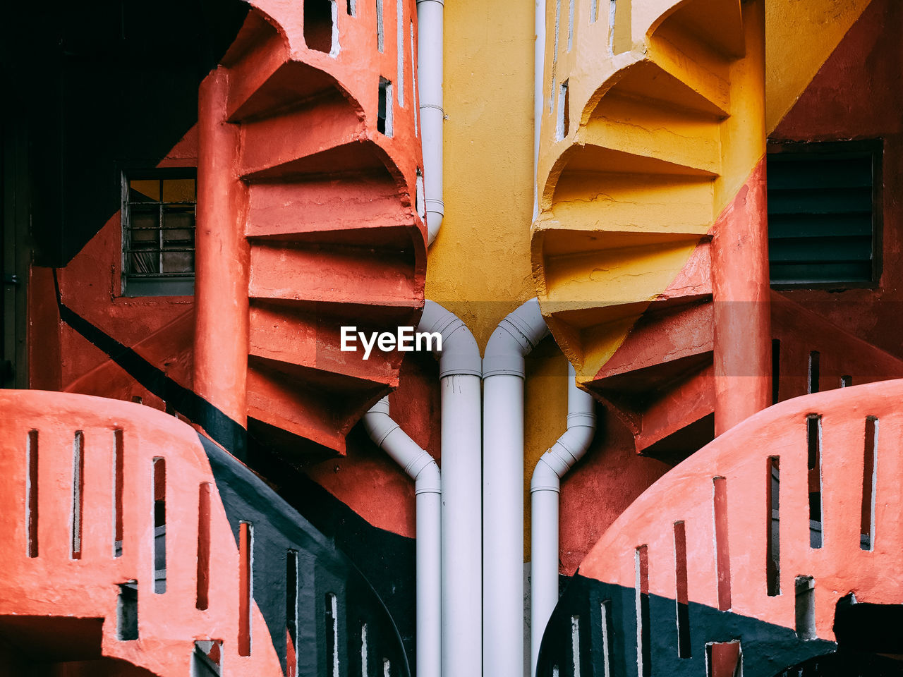 Close-up of colorful spiral staircases on a building