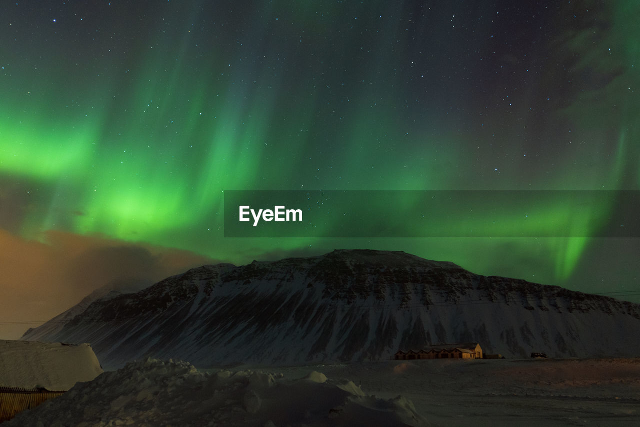 Scenic view of aurora borealis against sky at night