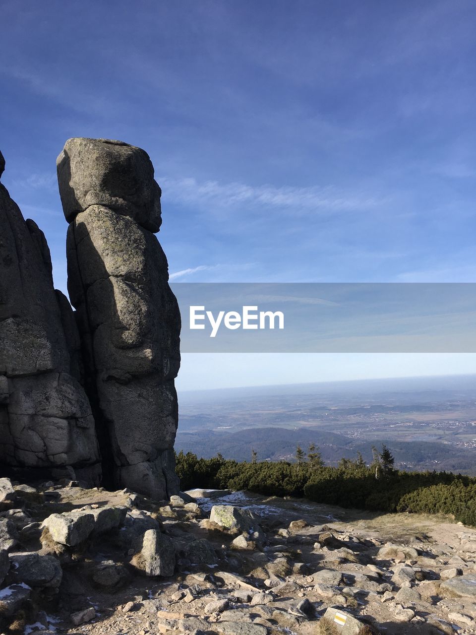 Rock formations on landscape against sky