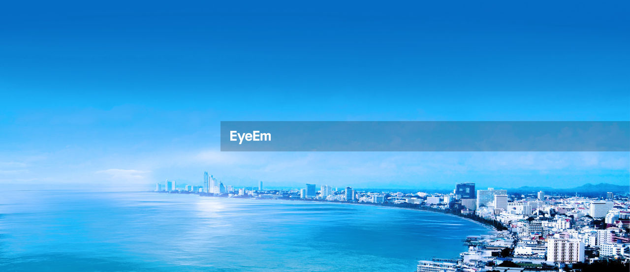 VIEW OF SEA AND BUILDINGS AGAINST SKY