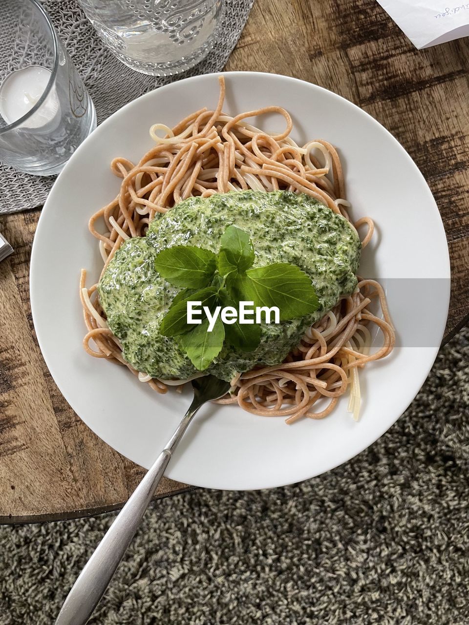 High angle view of pasta in plate on table