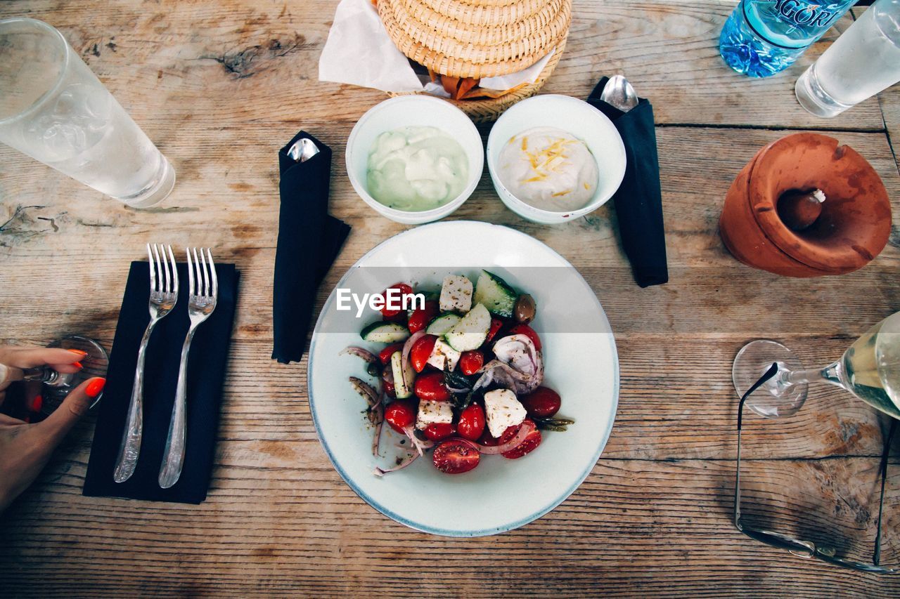 Directly above shot of salad in bowl on table in restaurant