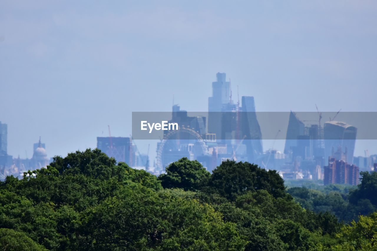 buildings in city against clear sky