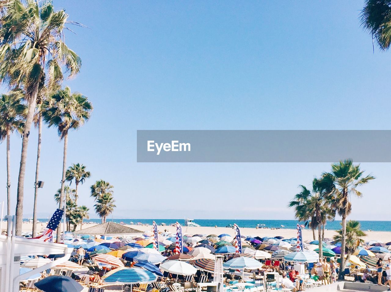 Beach umbrellas against clear sky