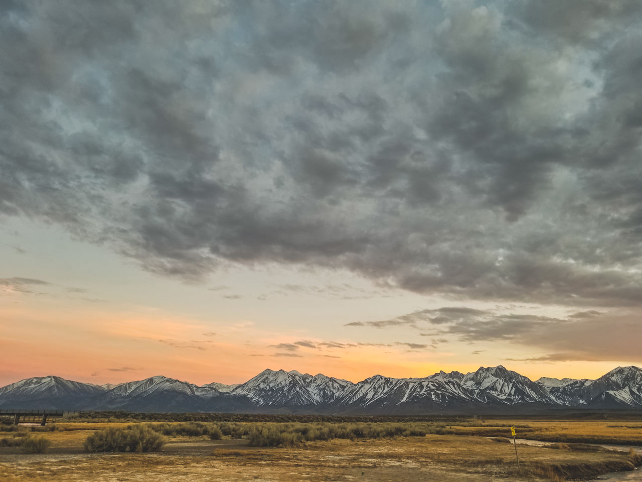 Dramatic orange sunset sky in the sierra nevada mountains in the owens river valley