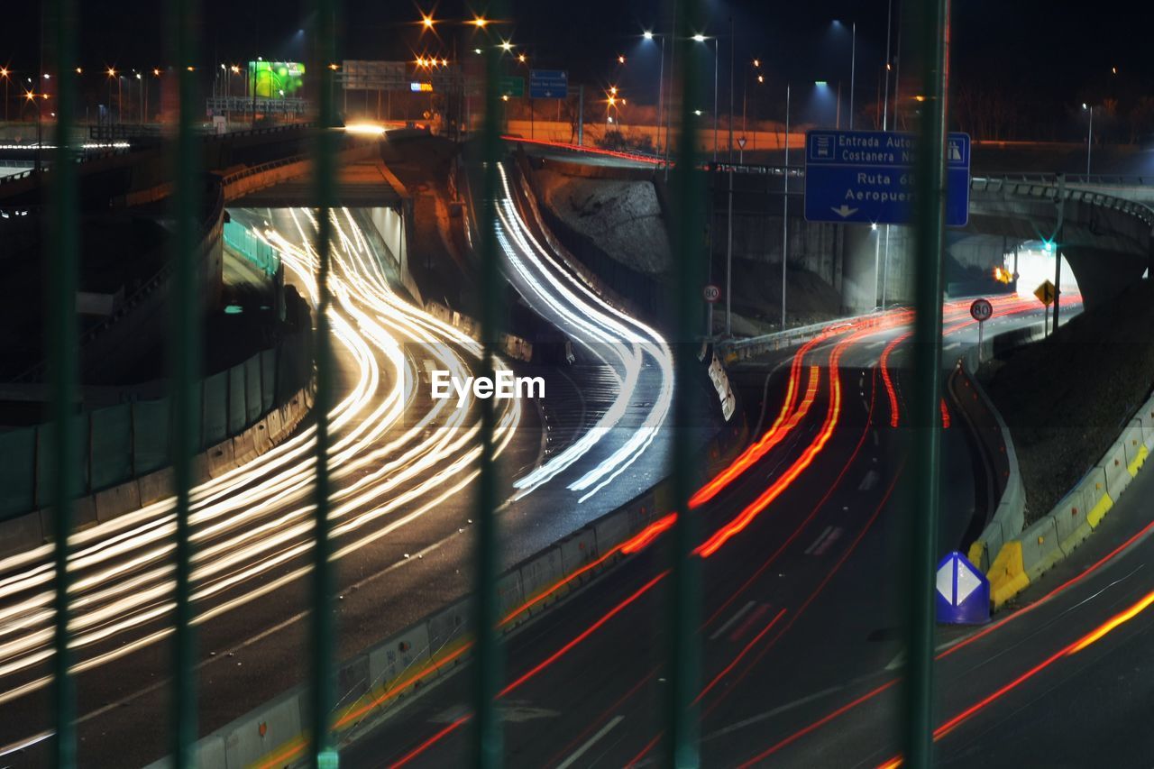 High angle view of light trails on road at night