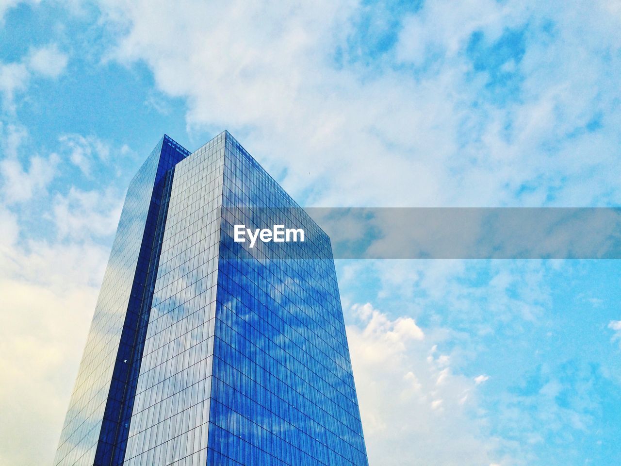 Reflection of clouds in modern building