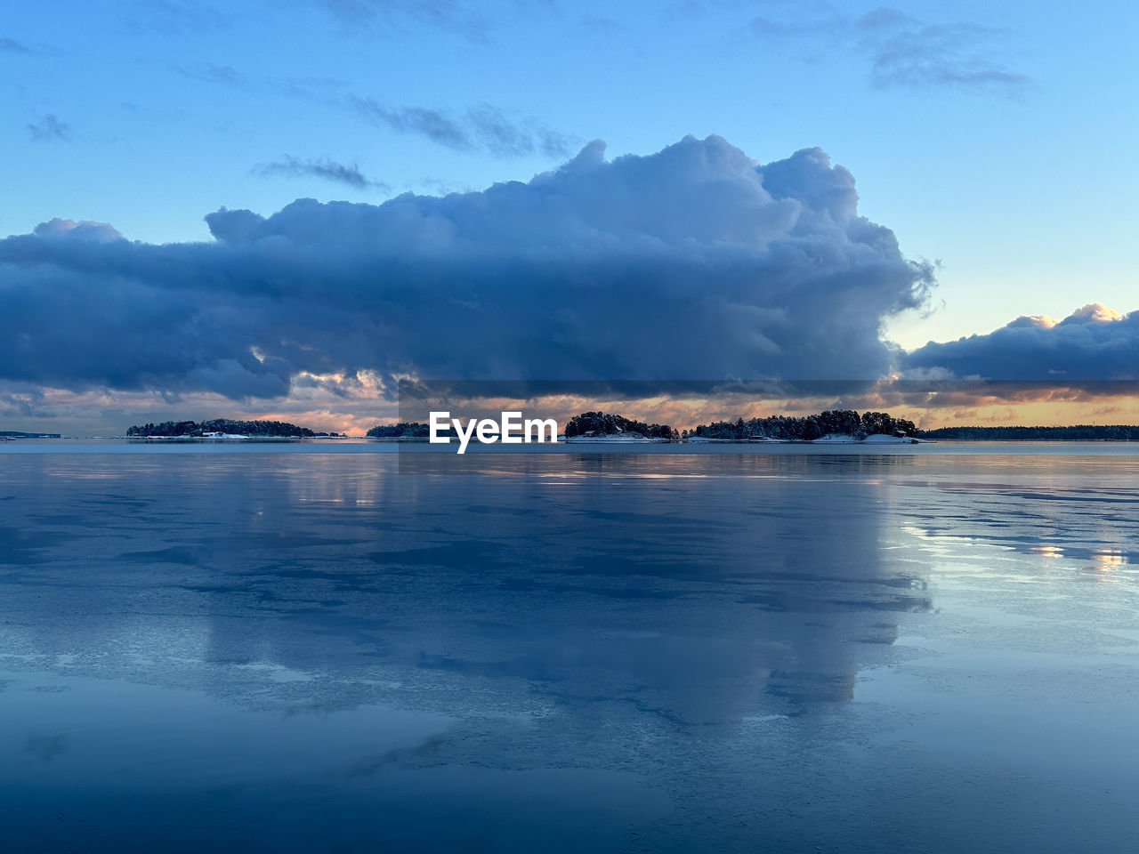 water, reflection, sky, sea, cloud, horizon, environment, scenics - nature, mountain, ocean, landscape, dawn, beauty in nature, nature, land, morning, travel destinations, cold temperature, sunrise, coast, wave, bay, travel, blue, tranquility, no people, tranquil scene, snow, body of water, lagoon, beach, shore, ice, winter, outdoors, mountain range, tourism, seascape, sunlight, dramatic sky, island, holiday, wind wave, trip, vacation