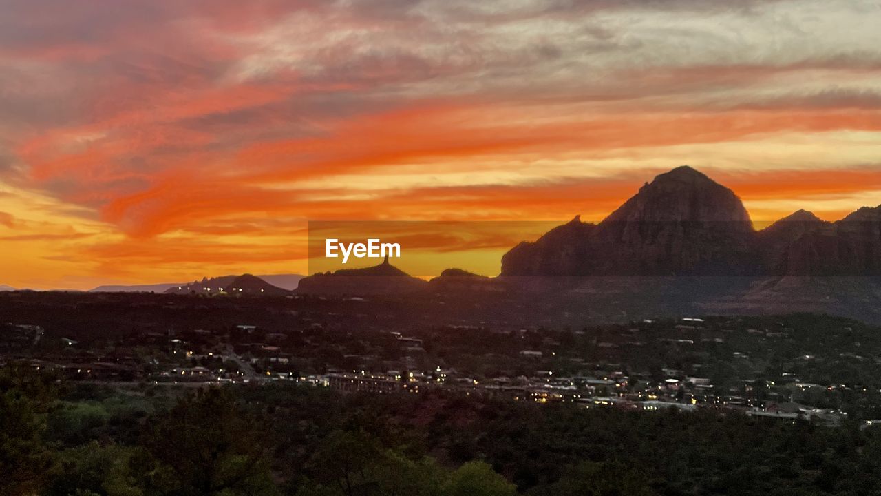 SCENIC VIEW OF MOUNTAINS DURING SUNSET