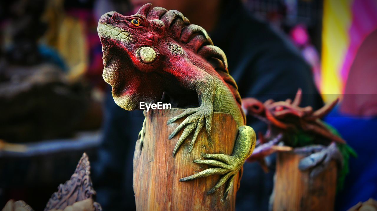 Close-up of lizard statue of wood