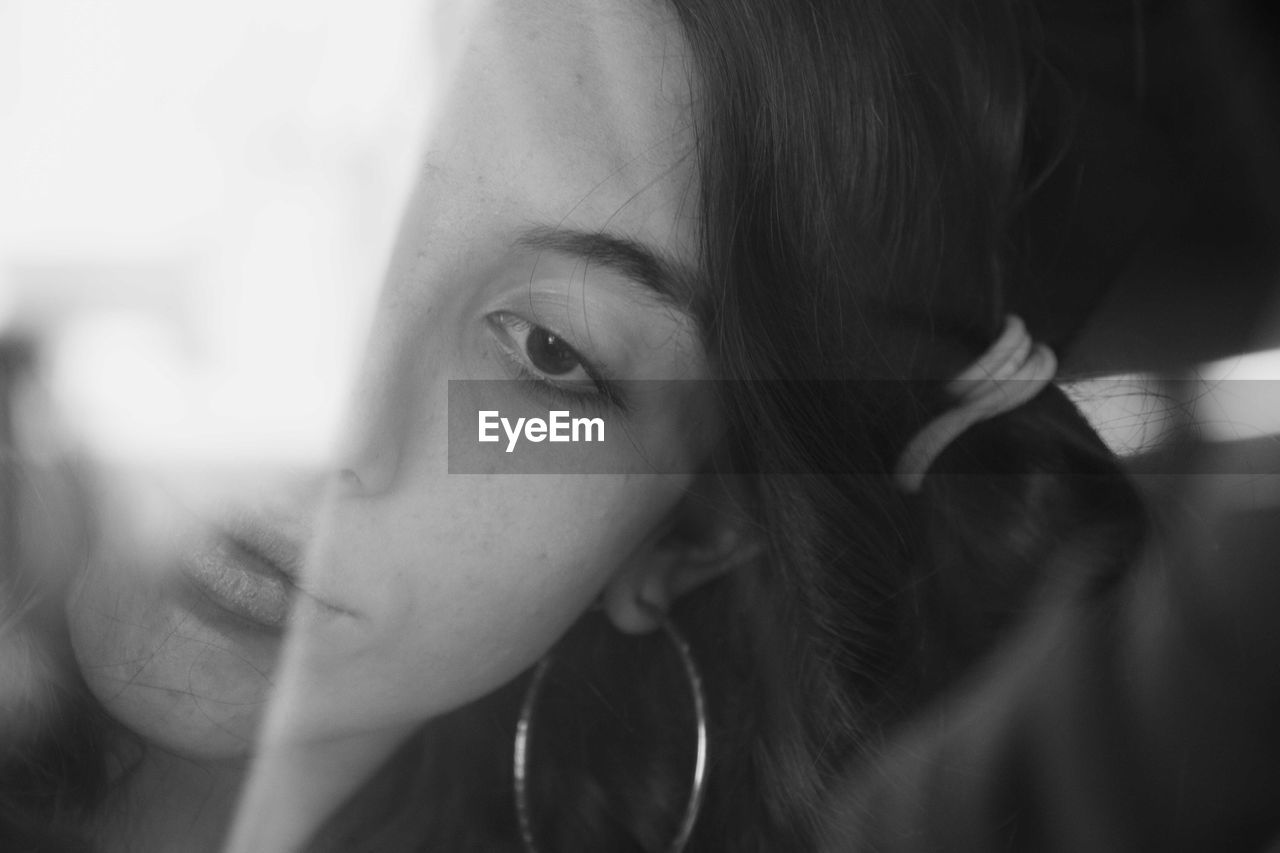 Close-up portrait of young woman looking away