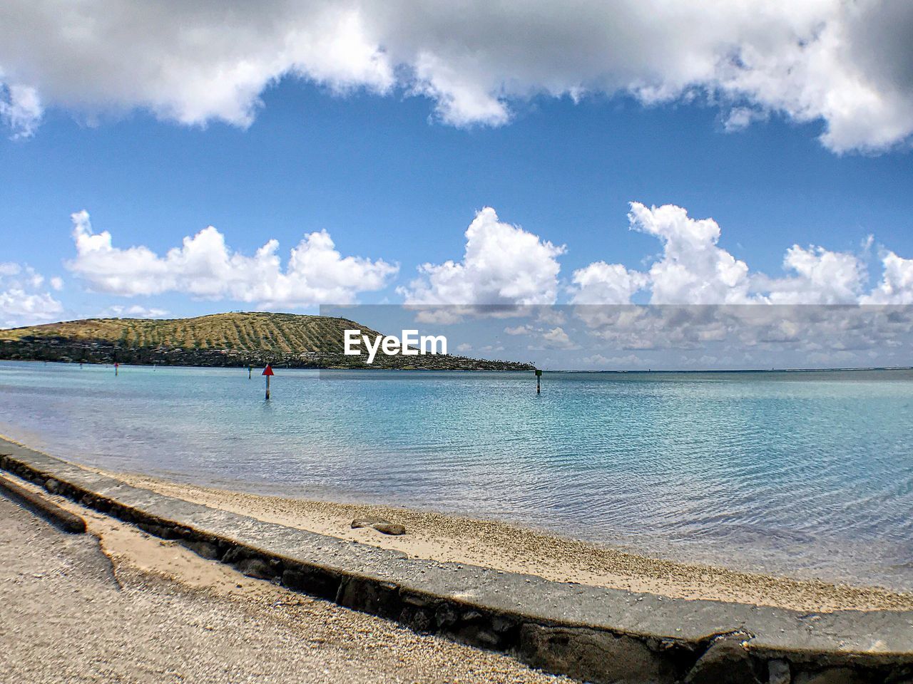 Scenic view of sea against cloudy sky