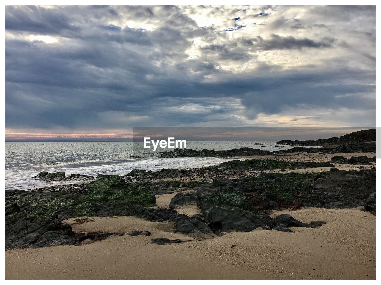 Scenic view of beach against sky