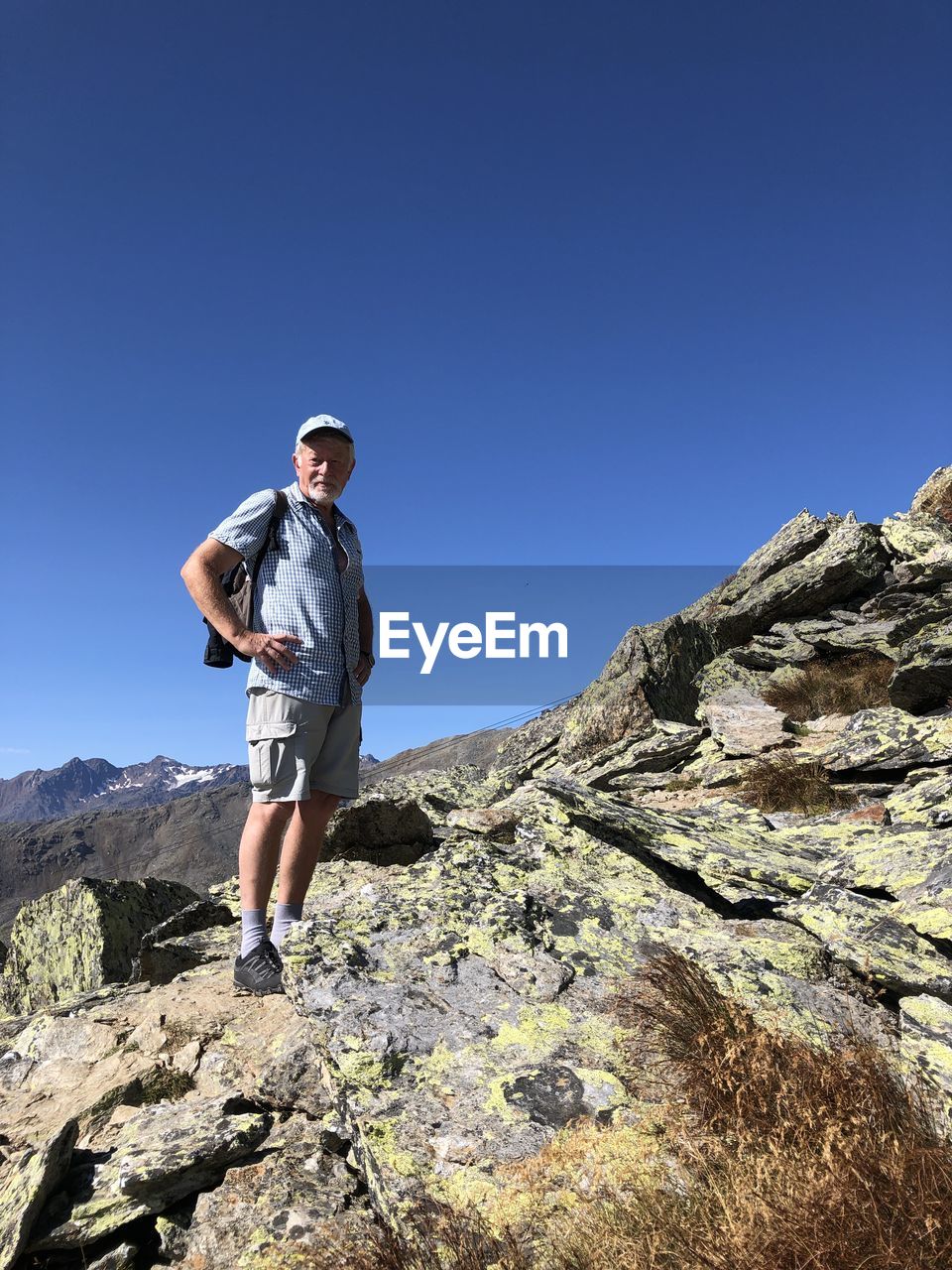 Full length of man standing on rock