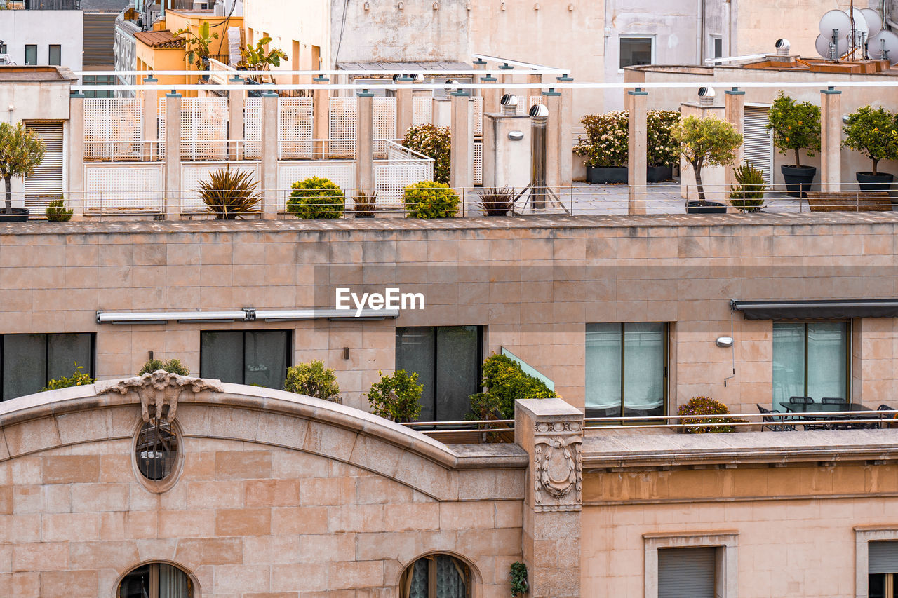 Exterior view of old architecture in central part of barcelona, spain. houses with terraces, decks