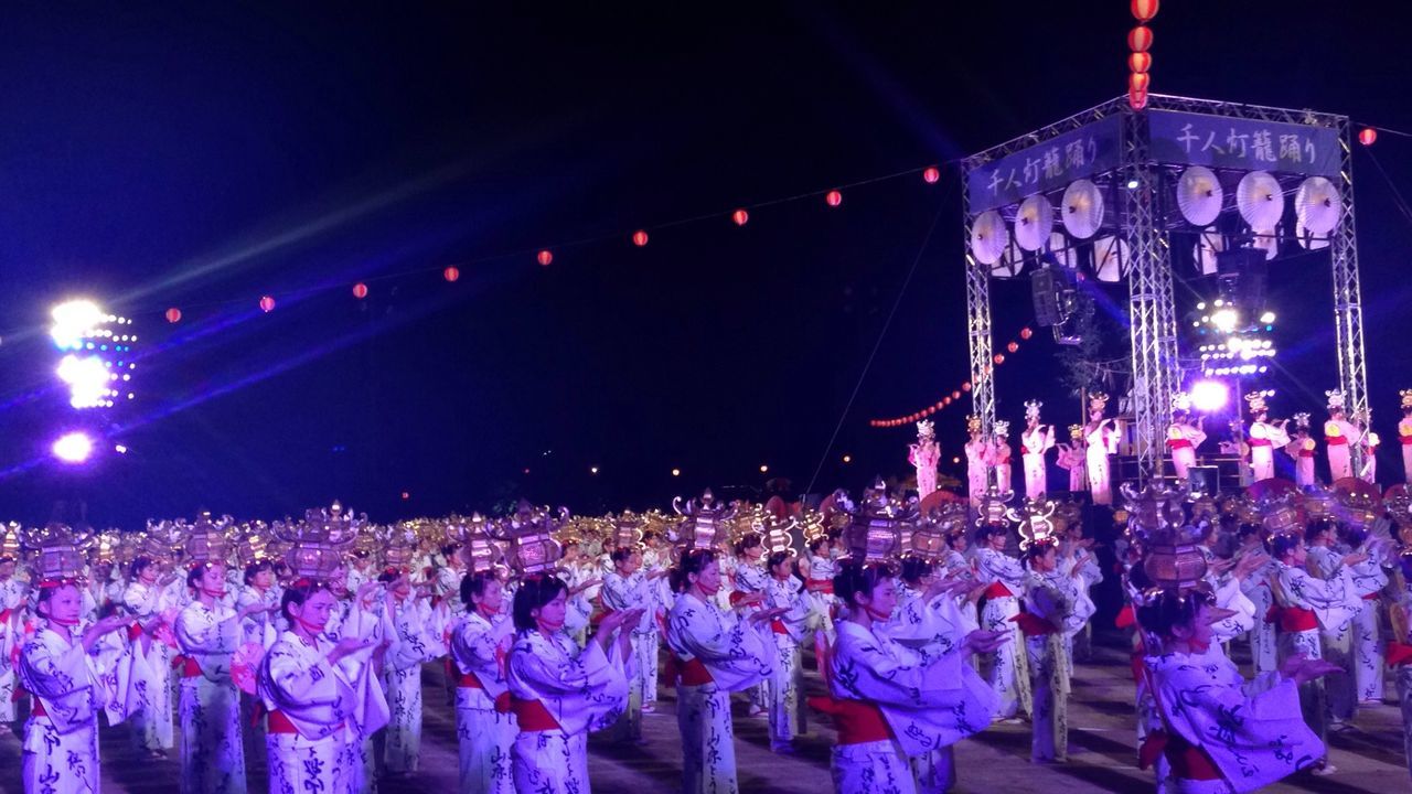 Large group of people in front of stage