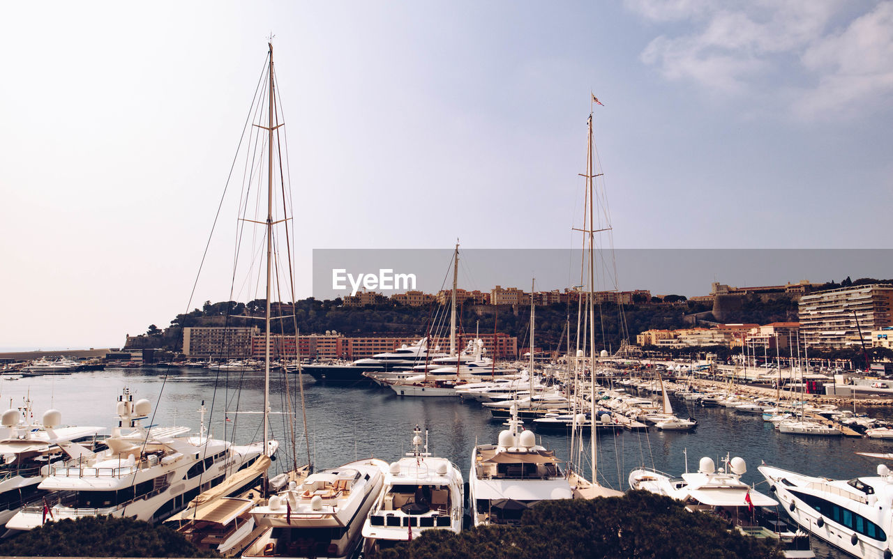 Boats moored at harbor