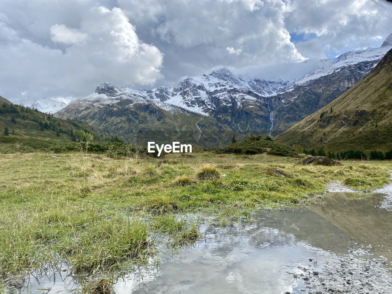 Scenic view of snowcapped mountains against sky