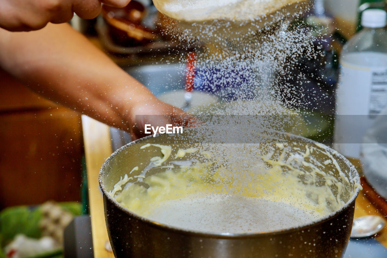 Close-up of man preparing food