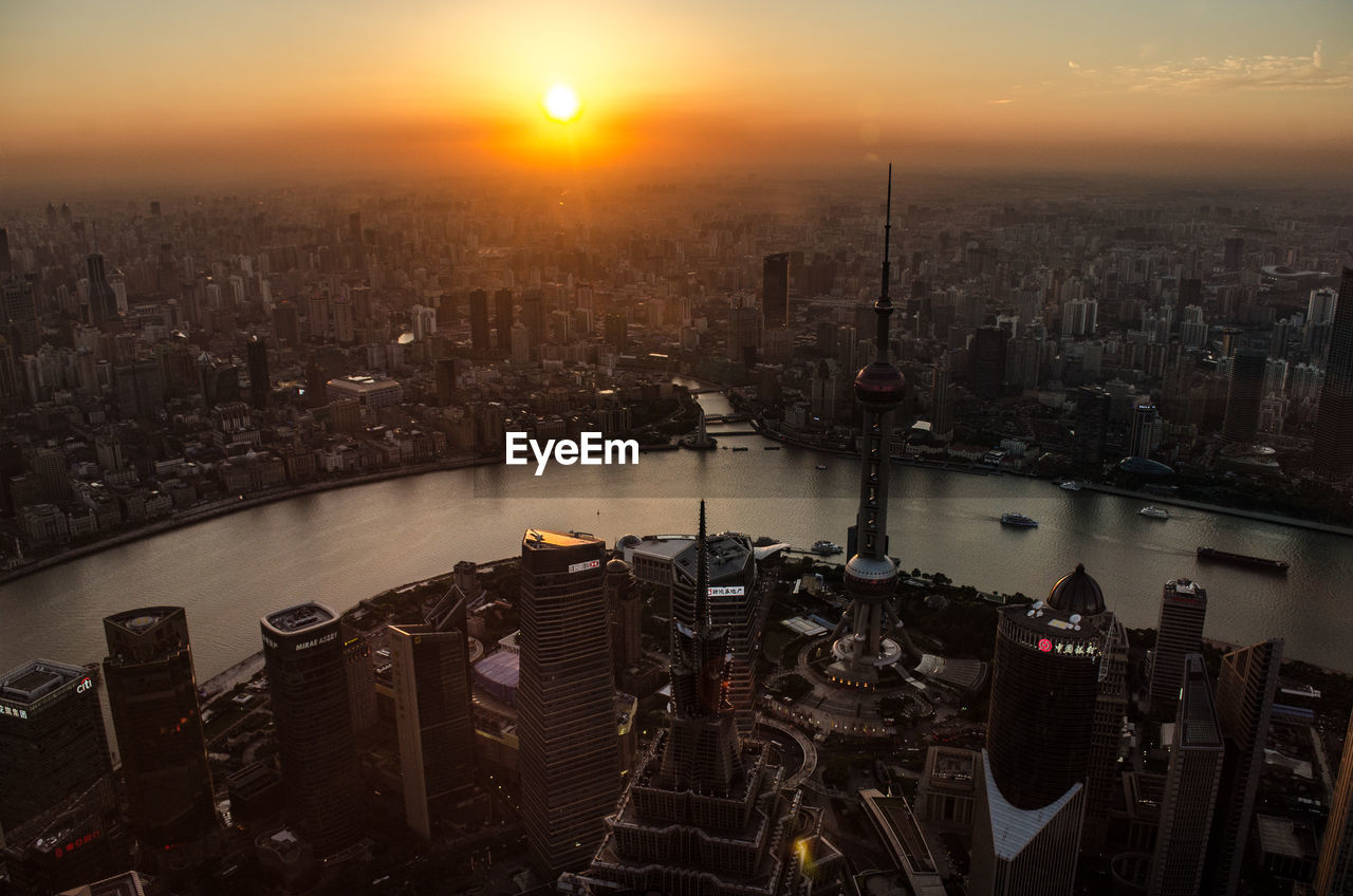 Aerial view of city during sunset