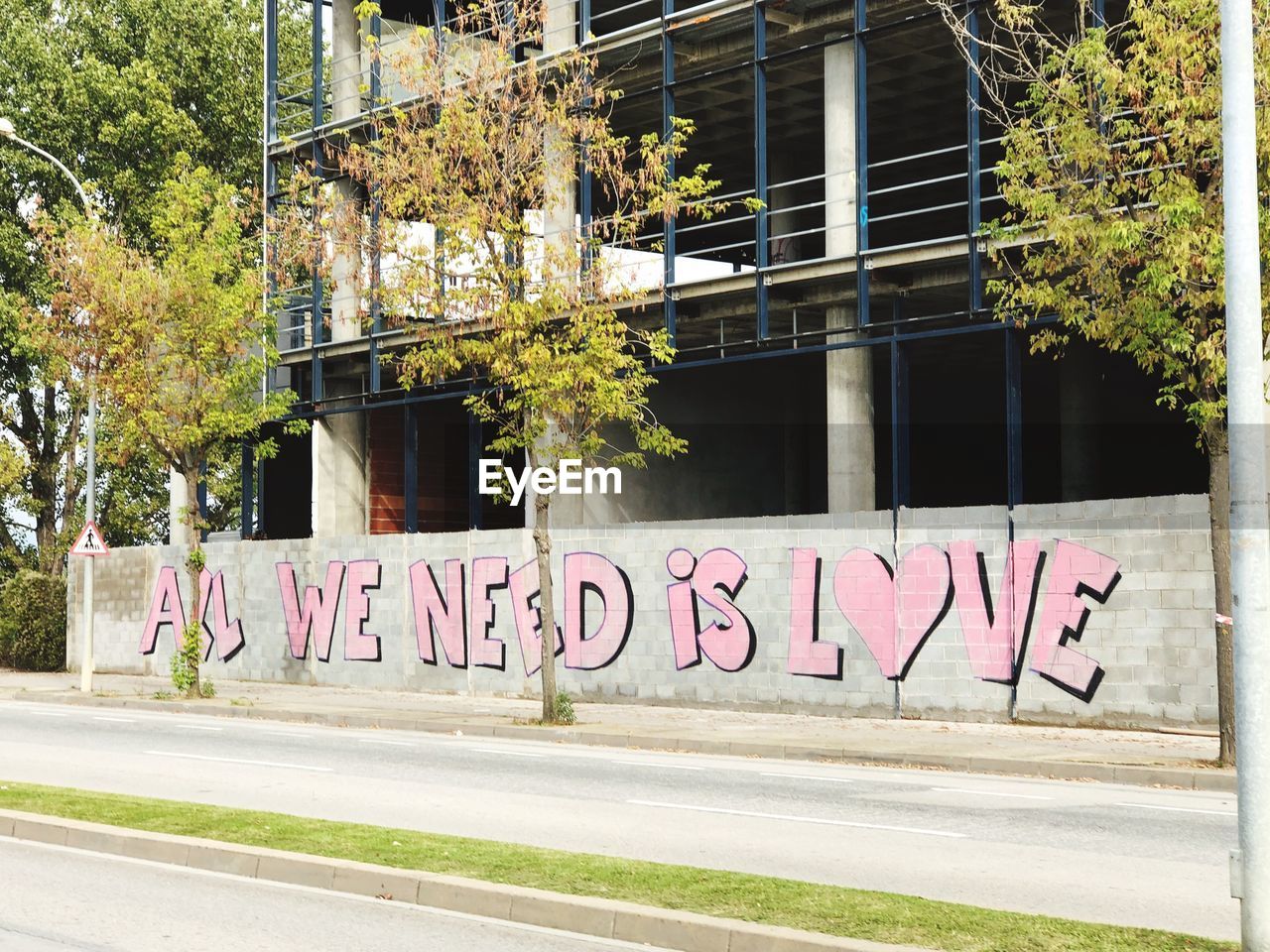 GRAFFITI ON BUILDING WALL BY STREET