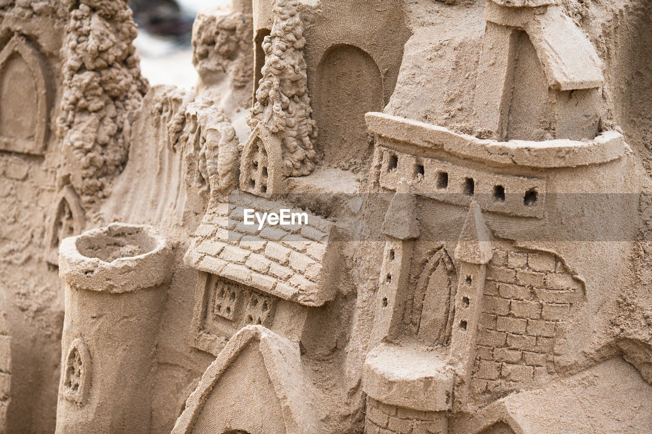 CLOSE-UP OF OLD RUINS AGAINST BUILDING