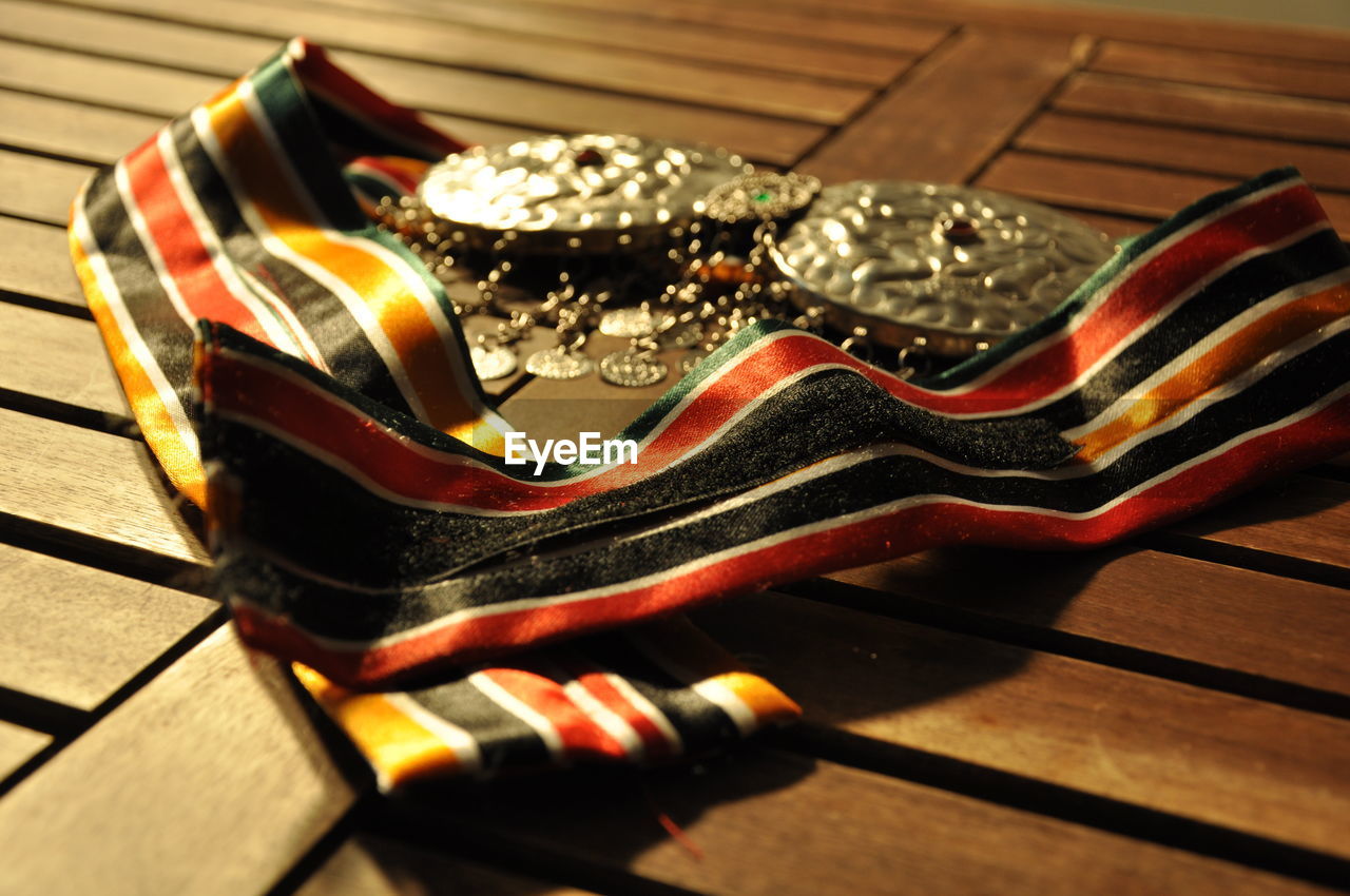 Close-up high angle view of medals on table