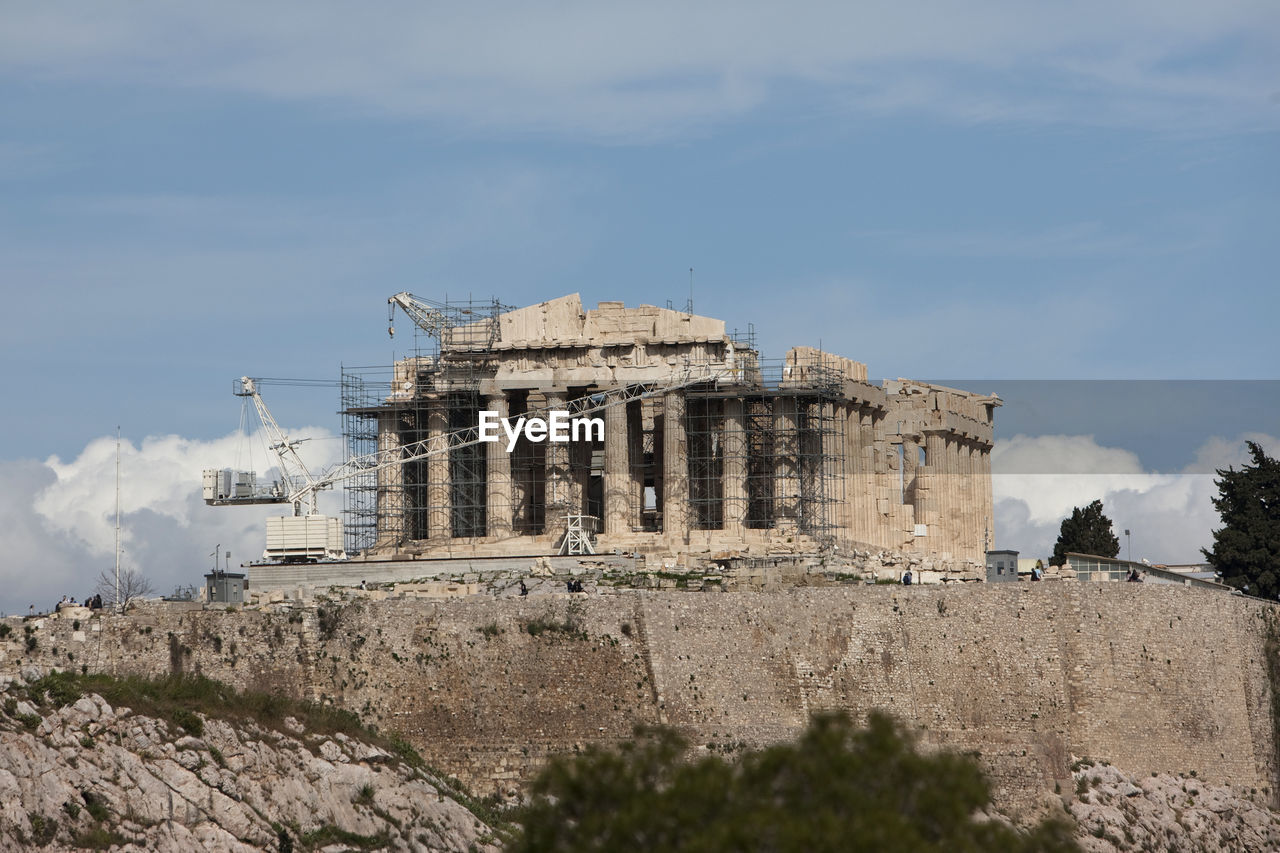 Parthenon with crane and scaffolding against sky