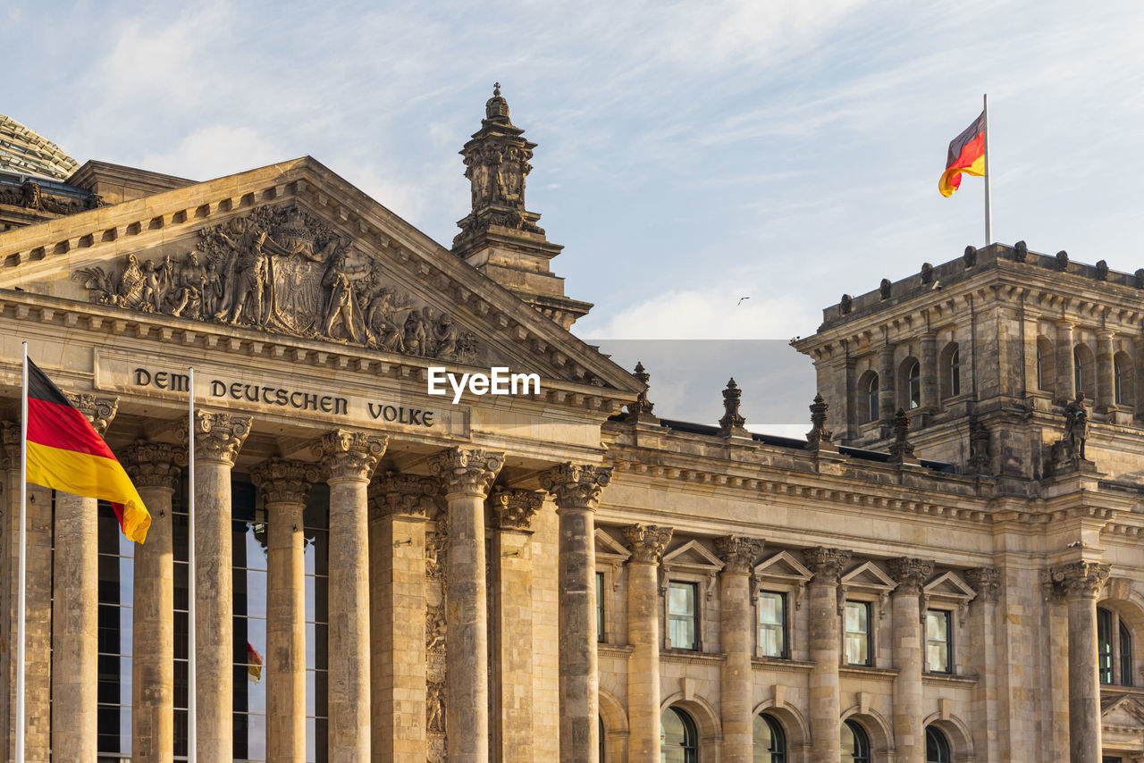 Front view of the bundestag reichstag parliament building in berlin, germany.