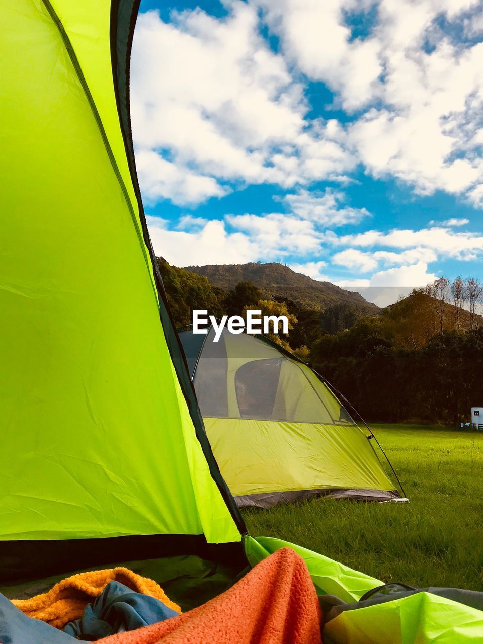 Tent on field against sky