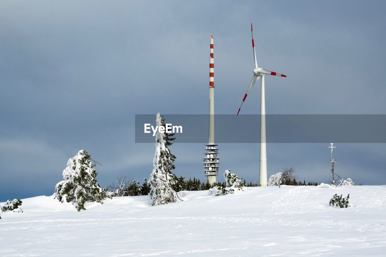 Low angle view of snow on mountain against sky