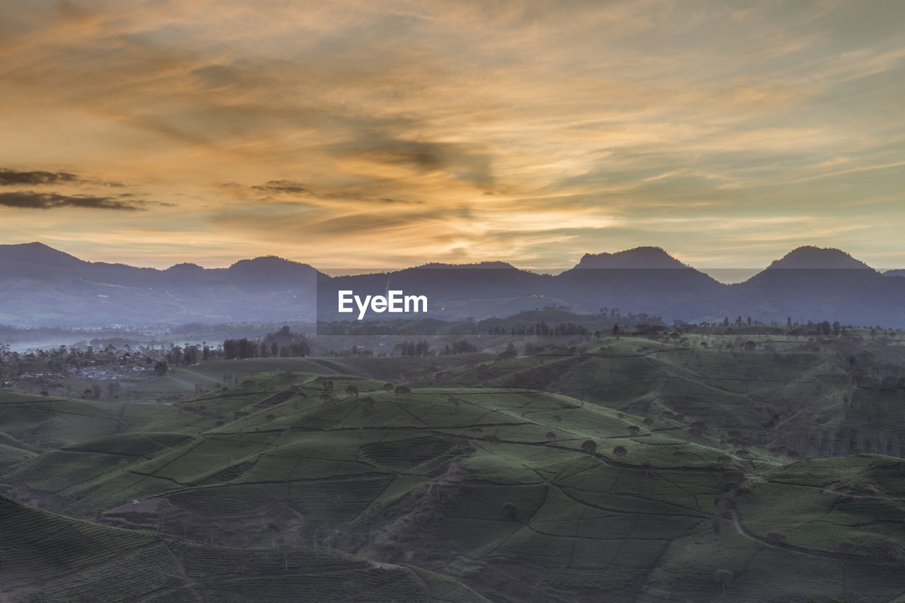 Scenic view of landscape against sky during sunset