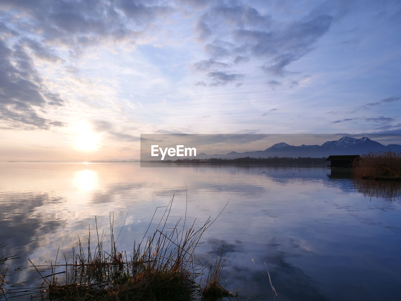 Scenic view of lake against sky during sunset