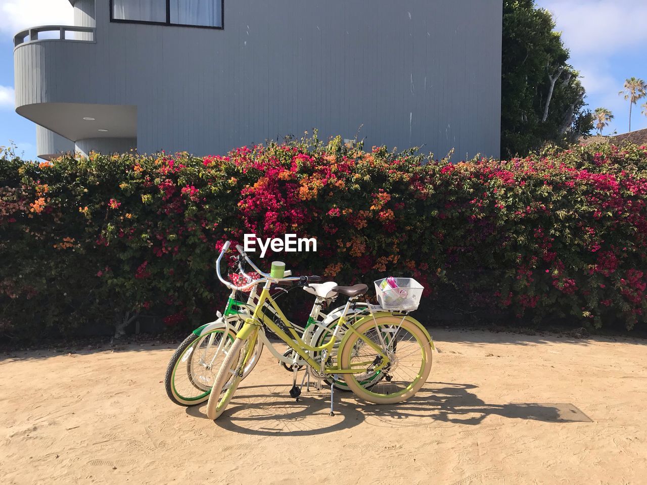 BICYCLE AGAINST RED BUILDING