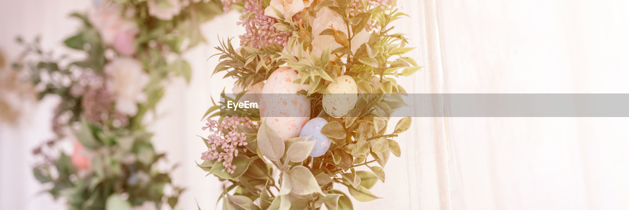 plant, pink, nature, floristry, flower, spring, indoors, no people, flowering plant, close-up, beauty in nature, yellow, bouquet, branch, decoration, pattern, freshness, white, interior design, floral design, curtain, hanging, focus on foreground