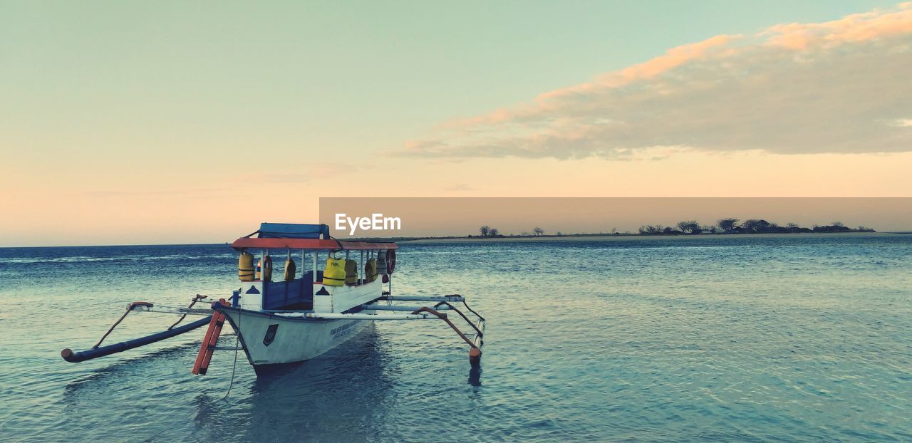 SCENIC VIEW OF SEA DURING SUNSET