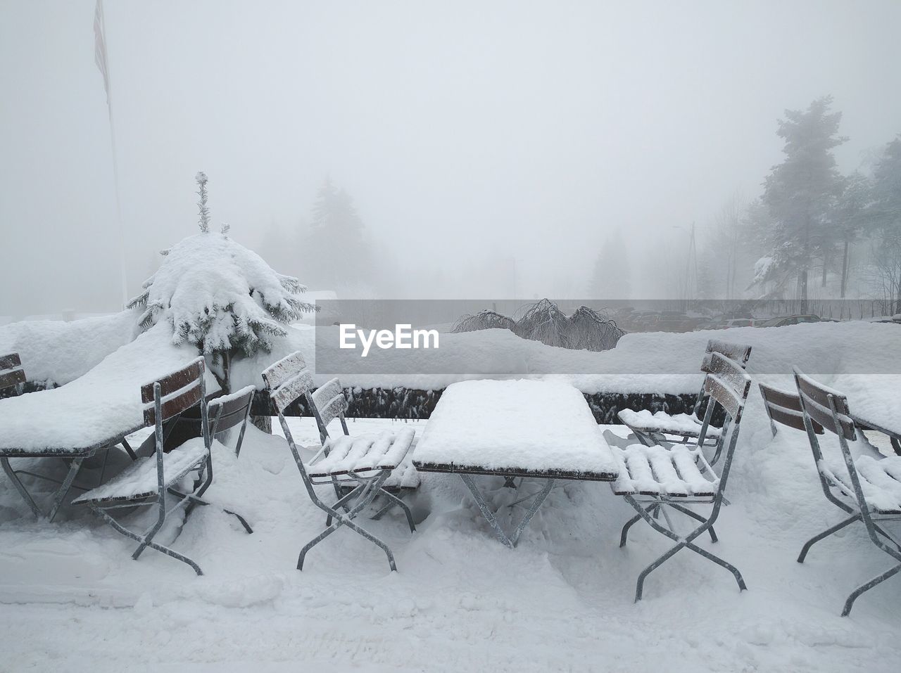 Snow on shore against sky during winter