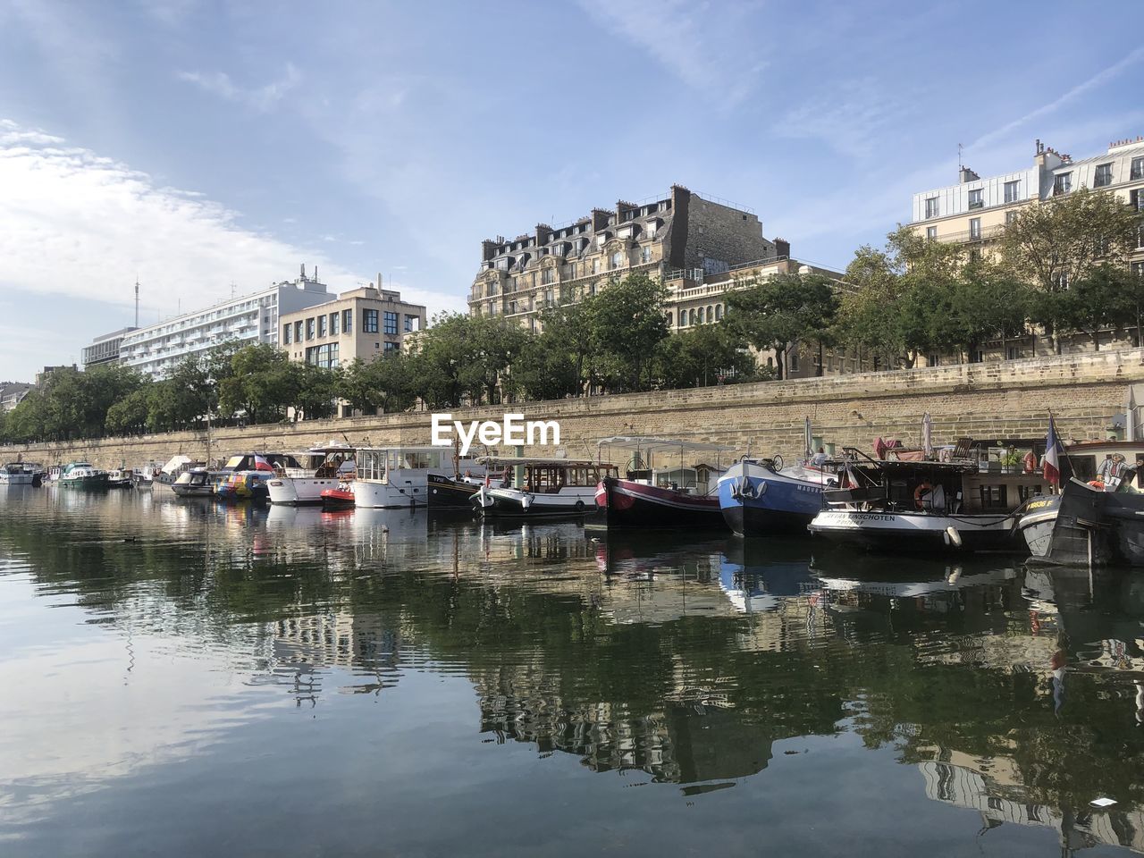 Boats moored in canal saint martin in paris 