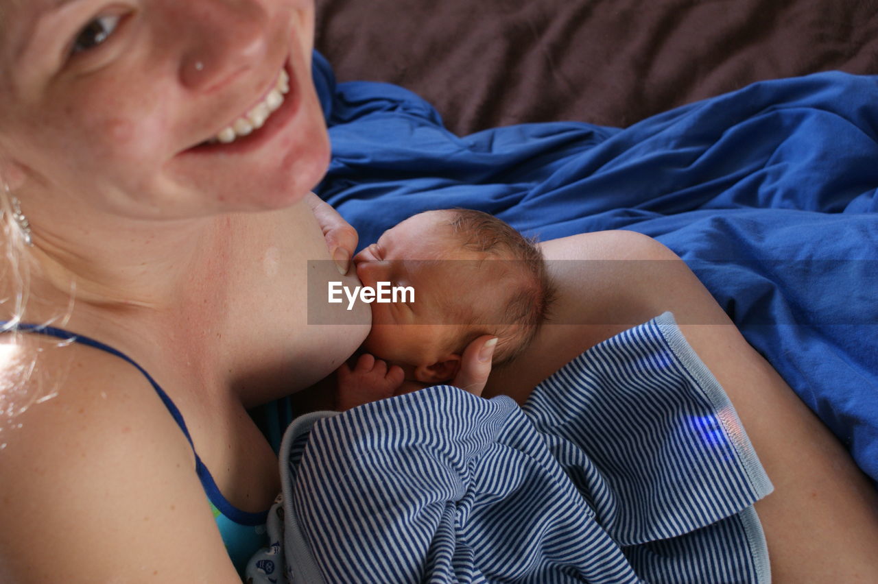 Portrait of woman breastfeeding baby