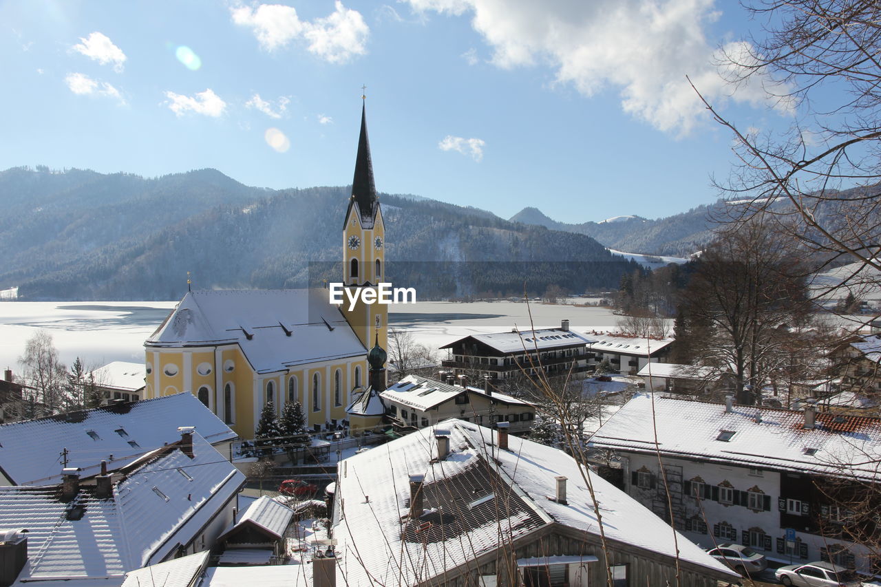 Panoramic view of church against sky during winter