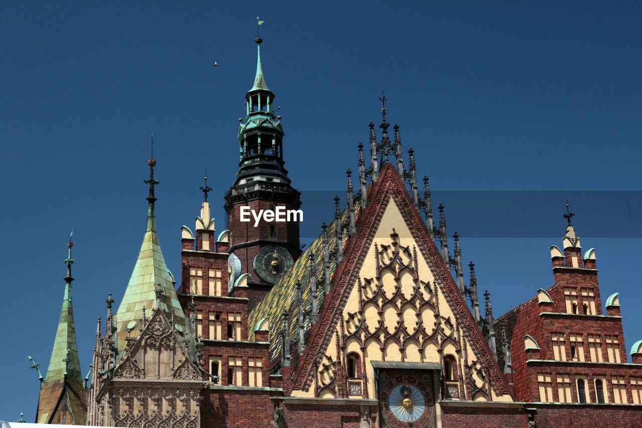 Low angle view of wroclaw town hall against clear sky