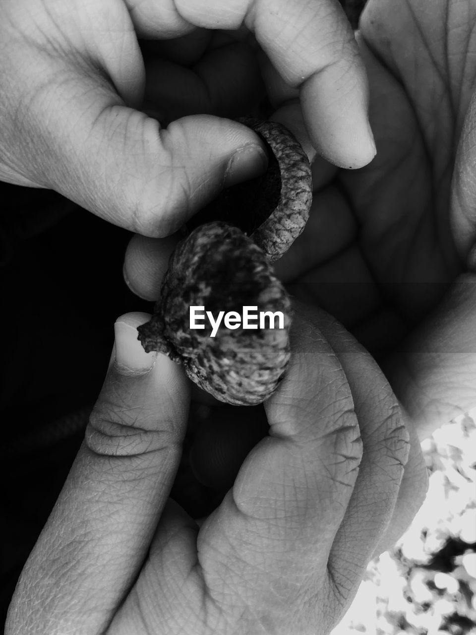 HIGH ANGLE VIEW OF HANDS HOLDING BABY