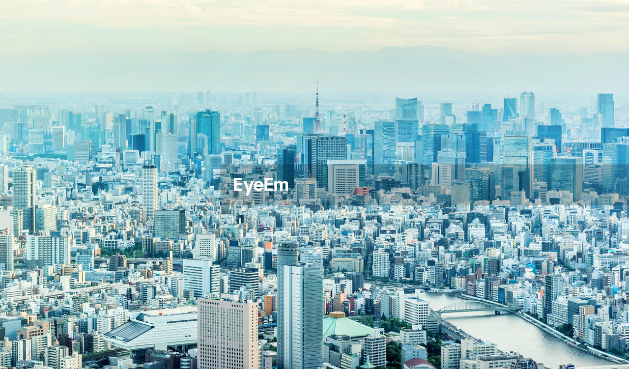 High angle view of modern buildings in city against sky