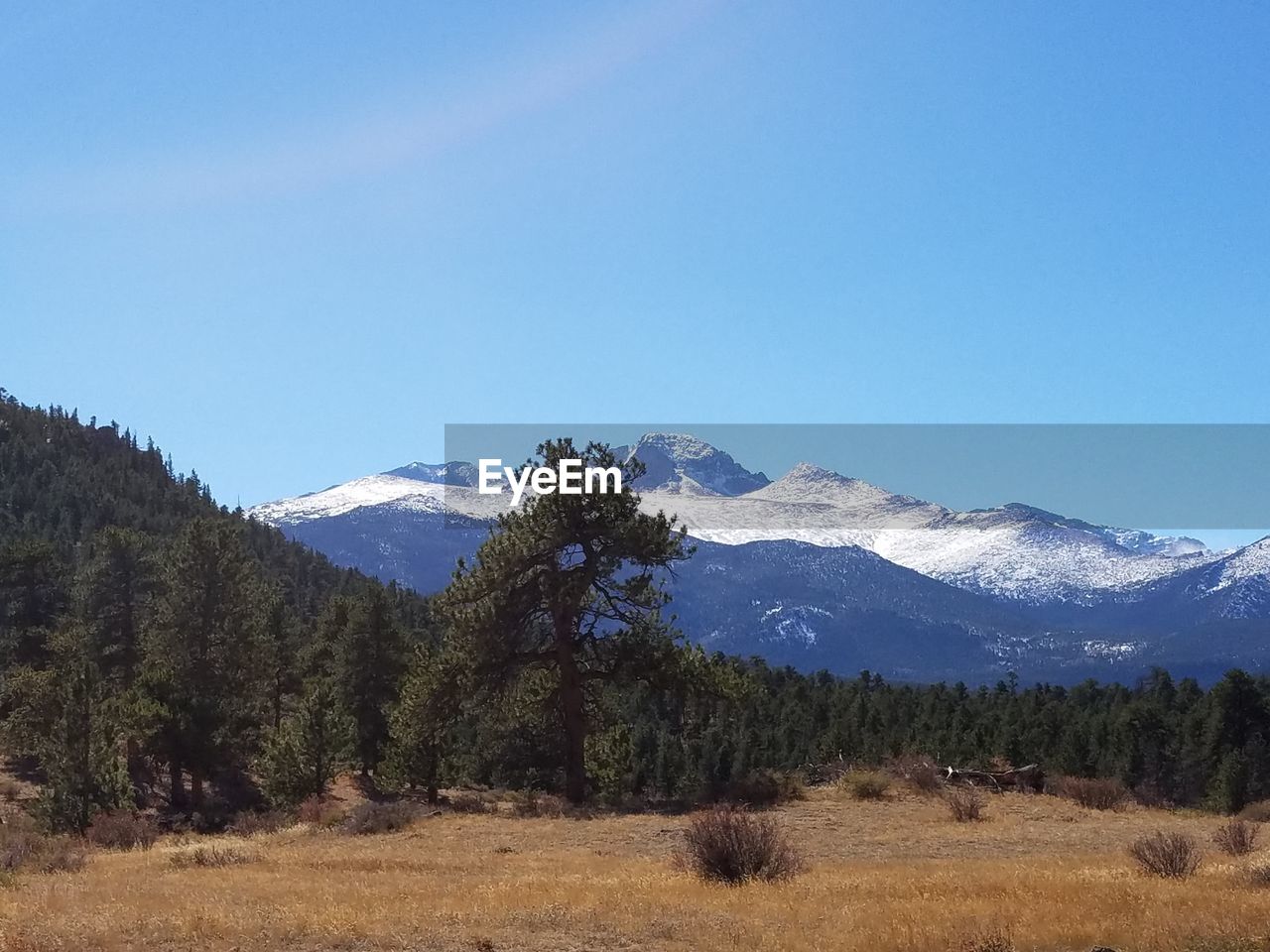 Scenic view of mountains against clear blue sky