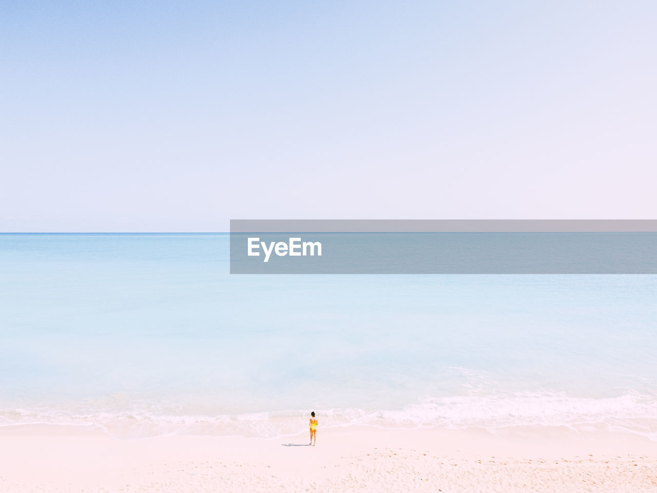 Scenic view of beach against clear sky