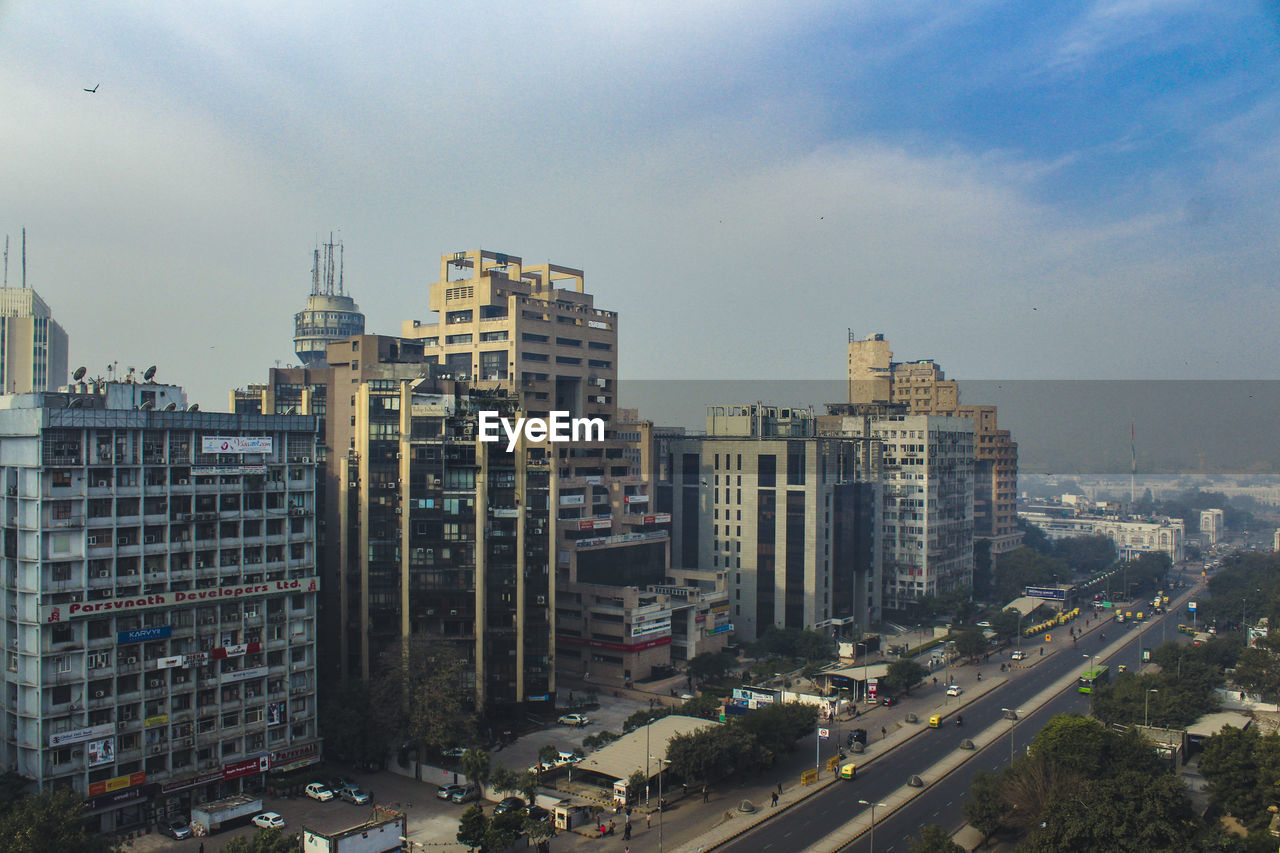 High angle view of buildings in city against sky