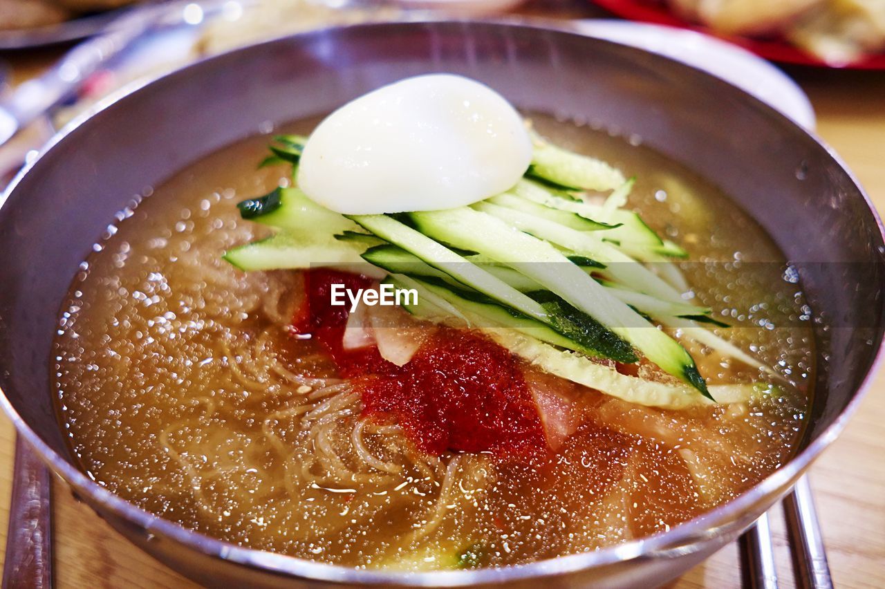 Close-up of naengmyeon served in bowl on table