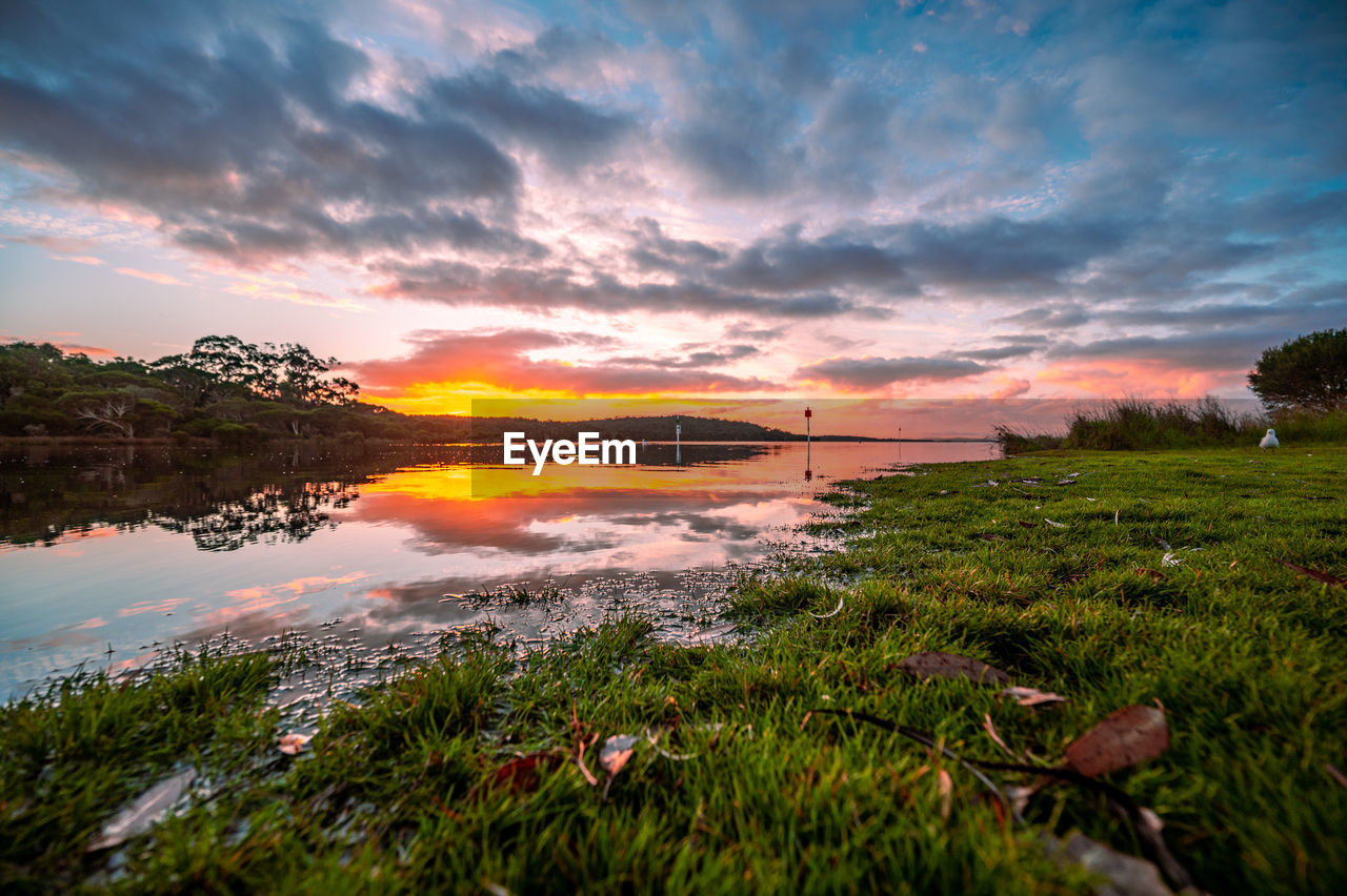 Scenic view of lake against sky during sunset