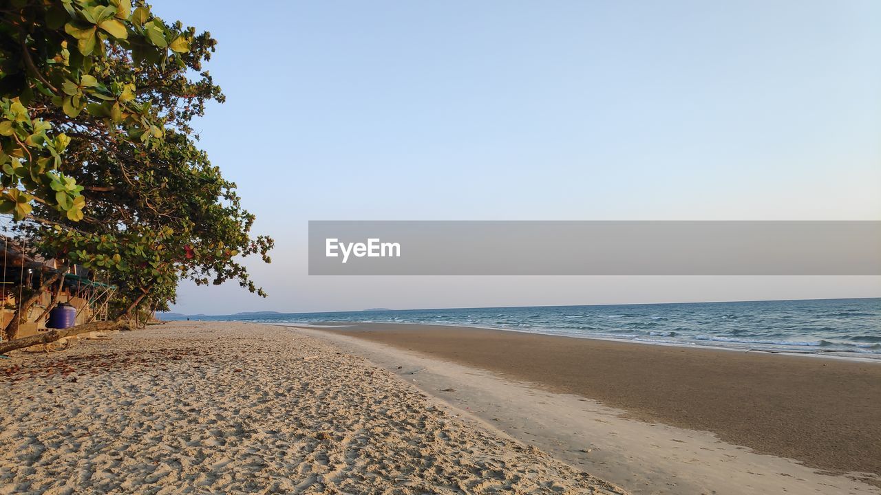 Scenic view of beach against clear sky