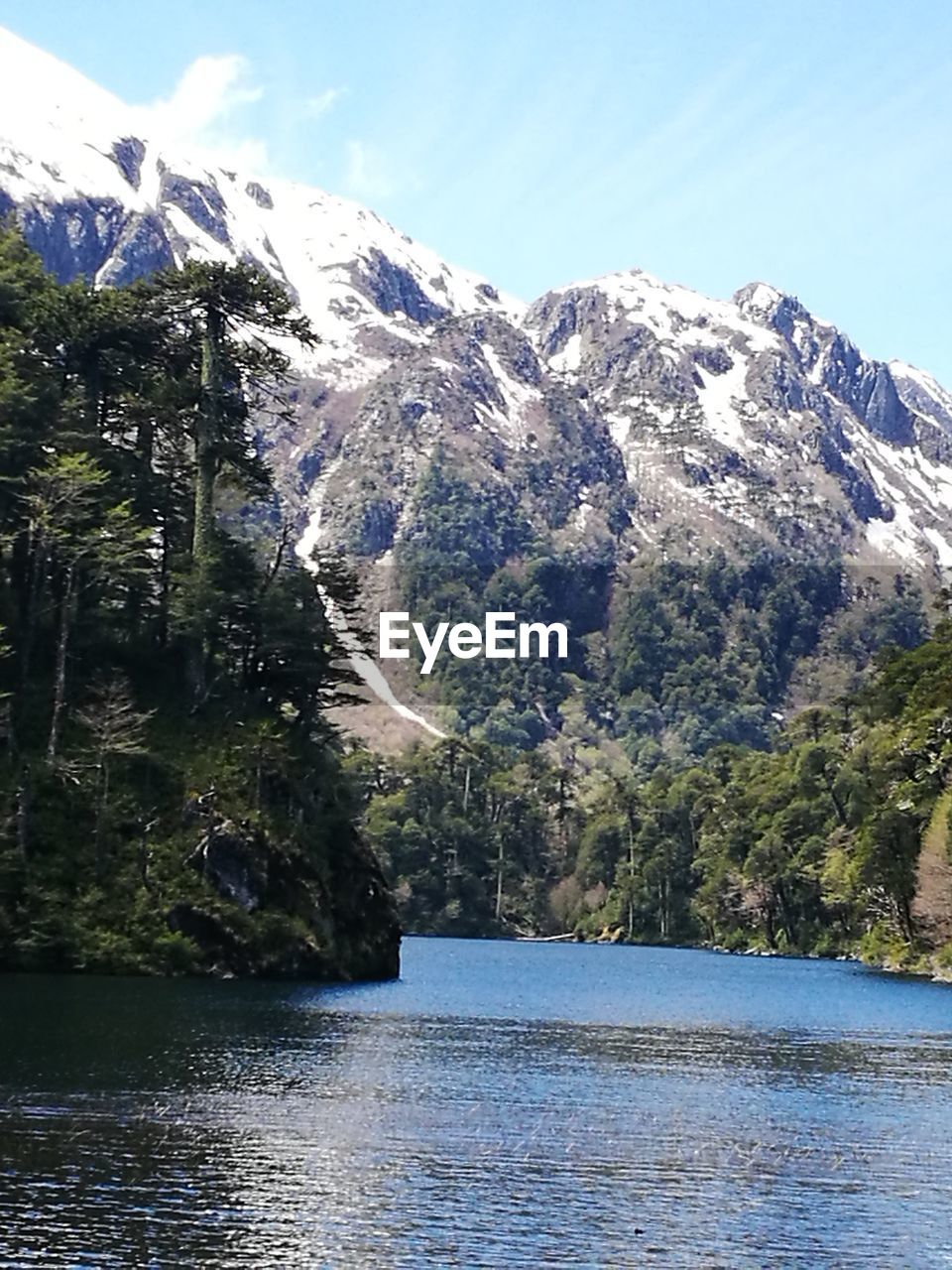 SCENIC VIEW OF SNOWCAPPED MOUNTAINS BY LAKE AGAINST SKY